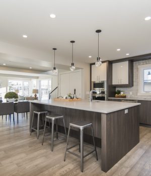 A beautiful shot of a modern house kitchen and dining room